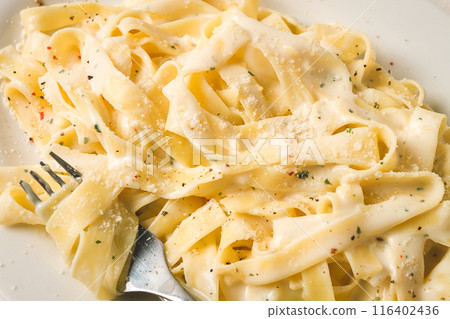 Fettuccine, tagliatelle, in creamy garlic sauce, Italian traditional cuisine, pasta carbonaro, Fettuccine, tagliatelle, in creamy garlic sauce, Italian traditional cuisine, pasta carbonaro, 116402436