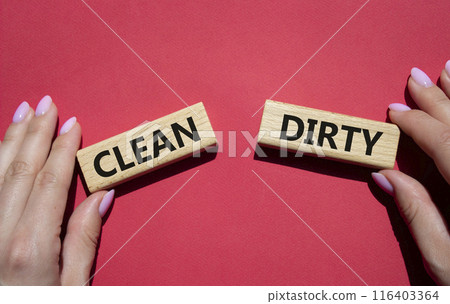 Clean or Dirty symbol. Concept word Clean or Dirty on wooden blocks. Man hand. Beautiful red background. Gender and Clean or Dirty concept. Copy space Clean or Dirty symbol. Concept word Clean or Dirty on wooden blocks. Man hand. Beautiful red background. Gender and Clean or Dirty concept. Copy space 116403364