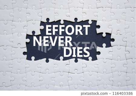 Effort never dies symbol. Concept words Effort never dies on white puzzle. Beautiful deep blue background. Business and Effort never dies concept. Copy space. Effort never dies symbol. Concept words Effort never dies on white puzzle. Beautiful deep blue background. Business and Effort never dies concept. Copy space. 116403386