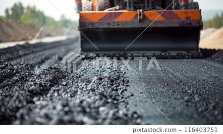 Road Construction with Heavy Machinery on a Sunny Day symbolizes progress in infrastructure and modern engineering 116403751