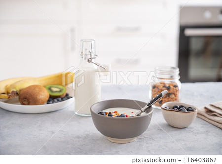 The concept of a healthy breakfast of vegetarian yogurt, granola and fresh fruit  116403862