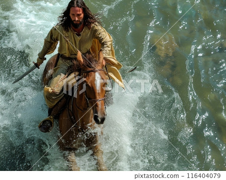 man, reminiscent of Jesus, rides confidently on the back of a majestic brown horse, holding a gleaming sword in his hand. 116404079