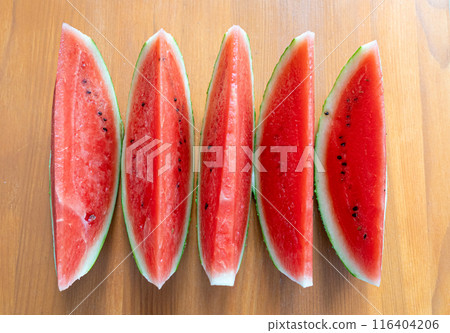 Watermelon slices closeup. Water melon wedges pile, Citrullus lanatus pieces, red wassermelone cuts group 116404206