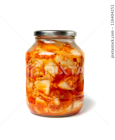 Kimchee in a glass jar isolated. Spicy kim chi, hot fermented napa cabbage, jimchi, korean gimchi Kimchee in a glass jar isolated. Spicy kim chi, hot fermented napa cabbage, jimchi, korean gimchi 116404251