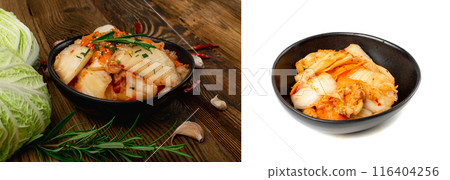 Kimchee in black bowl on wood table. Spicy kim chi pile, hot fermented napa cabbage, traditional jimchi 116404256