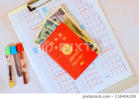 Expensive medicine, healthcare at Japan with stethoscope on heart electrocardiogram ECG, Japanese yen, Japanese passport 116404289