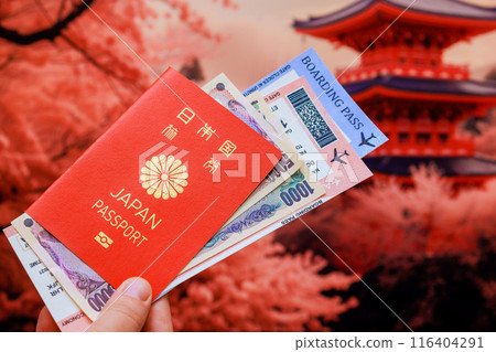 In Japanese old house background, tourist holds Japanese yen, Japan passport, tickets 116404291