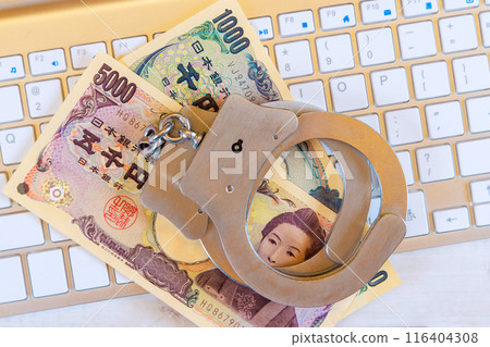 Cyber crime legal law police handcuffs on Japanese yen banknotes with computer keyboard technology of criminal Cyber crime legal law police handcuffs on Japanese yen banknotes with computer keyboard technology of criminal 116404308