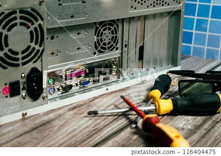 Some tools to repair a computer. 116404475