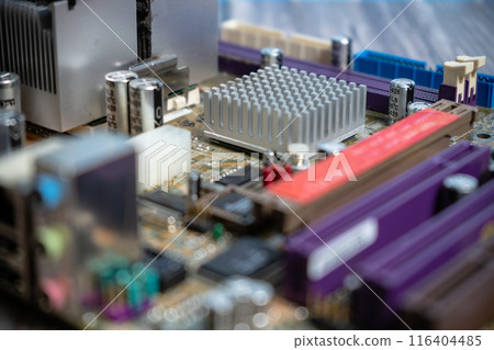Close-up of PC Motherboard on a wooden table. 116404485