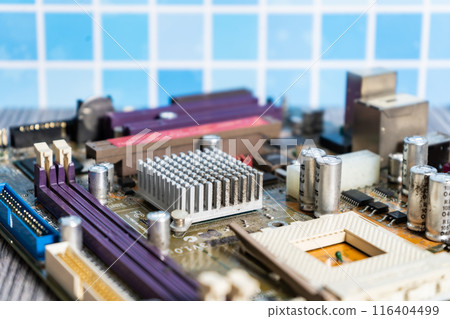 PC motherboard on a wooden table. 116404499