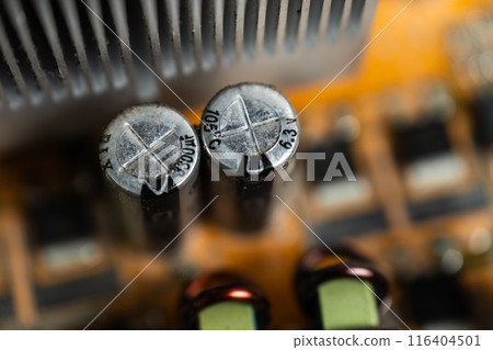 Close-up of a capacitor in one motherboard. 116404501