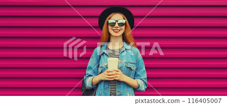 Portrait stylish happy young woman with coffee, modern girl in hat, glasses on pink background 116405007