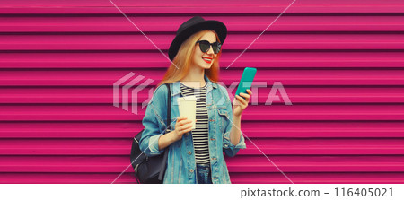Stylish modern young woman with phone, happy girl smiles using smartphone with cup of coffee Stylish modern young woman with phone, happy girl smiles using smartphone with cup of coffee 116405021