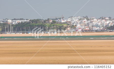 Boats and yachts in harbor on the beach timelapse in Portimao, Portugal 116405152