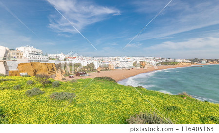 Wide sandy beach and Atlantic ocean in city of Albufeira timelapse. Algarve, Portugal Wide sandy beach and Atlantic ocean in city of Albufeira timelapse. Algarve, Portugal 116405163