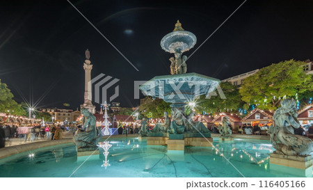 Panorama showing illuminated fountain with holiday decorations at the Rossio Christmas Market timelapse on Dom Pedro IV square. Lisbon, Portugal 116405166