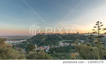 Panorama showing sunset over the Castle of Almourol on hill in Santarem aerial timelapse. Portugal Panorama showing sunset over the Castle of Almourol on hill in Santarem aerial timelapse. Portugal 116405179