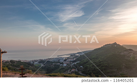 Panorama showing aerial View of Sesimbra Town and Port during sunset timelapse, Portugal. Panorama showing aerial View of Sesimbra Town and Port during sunset timelapse, Portugal. 116405201