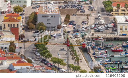 Aerial view of marina and city center timelapse in Setubal, Portugal. Aerial view of marina and city center timelapse in Setubal, Portugal. 116405208