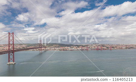 Panorama showing Lisbon cityscape and Tagus river timelapse with 25 of April bridge 116405213