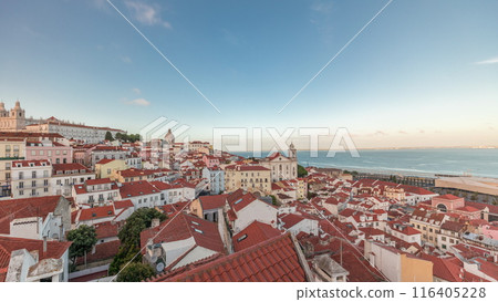 Panorama showing aerial view of Alfama in Lisbon timelapse during sunset. Panorama showing aerial view of Alfama in Lisbon timelapse during sunset. 116405228