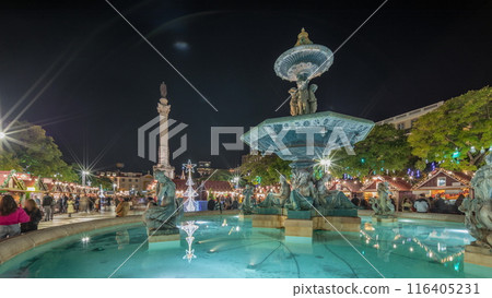 Panorama showing illuminated fountain with holiday decorations at the Rossio Christmas Market timelapse on Dom Pedro IV square. Lisbon, Portugal 116405231