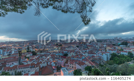 Panorama showing aerial cityscape day to night transition from Miradouro da Graca viewing point in Lisbon city after sunset Panorama showing aerial cityscape day to night transition from Miradouro da Graca viewing point in Lisbon city after sunset 116405274