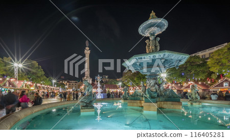 Panorama showing illuminated fountain with holiday decorations at the Rossio Christmas Market timelapse on Dom Pedro IV square. Lisbon, Portugal 116405281