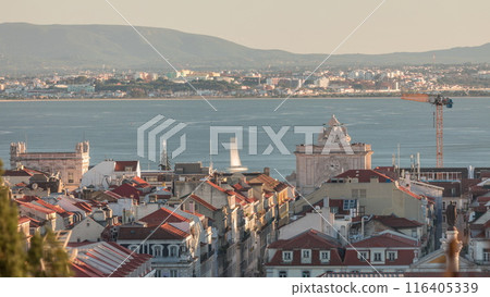 Aerial view of Lisboa downtown timelapse during sunset. Panoramic of Baixa, Rossio and Chiado red rooftops from above. Portugal 116405339