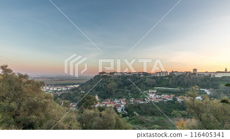 Panorama showing sunset over the Castle of Almourol on hill in Santarem aerial timelapse. Portugal 116405341