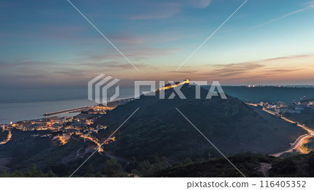 Panorama showing aerial view of Sesimbra Town and Port day to night timelapse, Portugal. 116405352