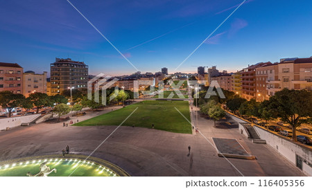 Panorama showing lawn at Alameda Dom Afonso Henriques and the Luminous Fountain aerial day to night timelapse in Lisbon. Panorama showing lawn at Alameda Dom Afonso Henriques and the Luminous Fountain aerial day to night timelapse in Lisbon. 116405356