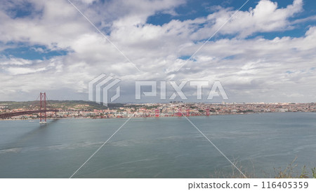 Panorama showing Lisbon cityscape and Tagus river timelapse with 25 of April bridge 116405359
