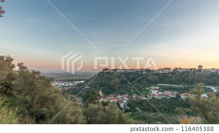 Panorama showing sunset over the Castle of Almourol on hill in Santarem aerial timelapse. Portugal Panorama showing sunset over the Castle of Almourol on hill in Santarem aerial timelapse. Portugal 116405388