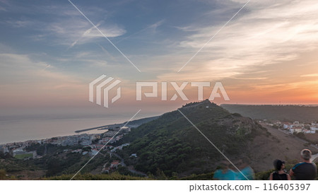 Panorama showing aerial View of Sesimbra Town and Port during sunset timelapse, Portugal. Panorama showing aerial View of Sesimbra Town and Port during sunset timelapse, Portugal. 116405397