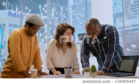 During an office tour, business woman negotiating contract terms and reaching an agreement with the realtor financier. Entrepreneur looking to develop a professional workspace. Camera A. 116405447