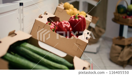 Natural organic fruits and vegetables stored in biodegradable crates, small business concept. Freshly harvested chemicals free food items in environmentally conscious zero waste supermarket Natural organic fruits and vegetables stored in biodegradable crates, small business concept. Freshly harvested chemicals free food items in environmentally conscious zero waste supermarket 116405550