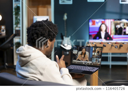African american man and coworkers in teleconference crosschecking analytics statistical data sets from apartment office. Remote worker optimizing KPIs with colleagues in videocall African american man and coworkers in teleconference crosschecking analytics statistical data sets from apartment office. Remote worker optimizing KPIs with colleagues in videocall 116405726