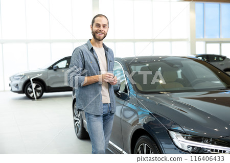 Confident young man in casual clothes near the car 116406433