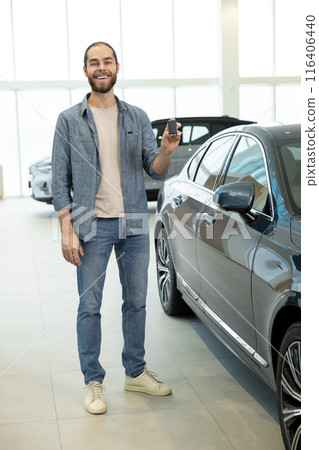 Confident young man in casual clothes near the car 116406440