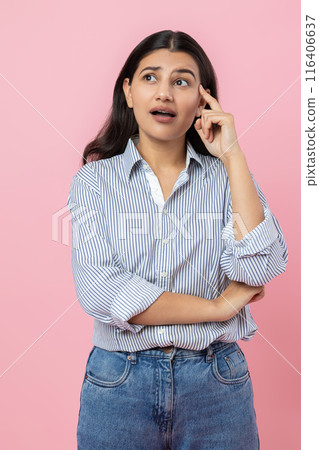 Puzzled Indian woman holding chin thinking trying to forgot something Puzzled Indian woman holding chin thinking trying to forgot something 116406637