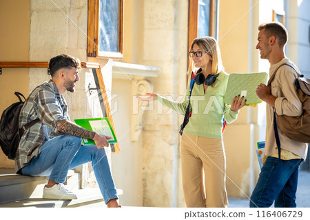 Friendly students have conversation sharing ideas enhancing their teamwork 116406729