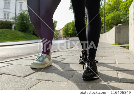 Unrecognizable women running during sunny morning Unrecognizable women running during sunny morning 116406849