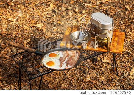 Campfire and breakfast at campsite Campfire and breakfast at campsite 116407570