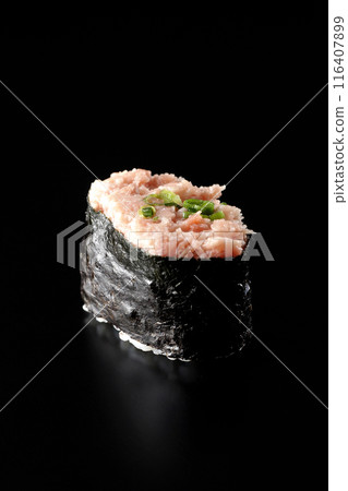 Negitoro gunkanmaki photographed against a black background Negitoro gunkanmaki photographed against a black background 116407899