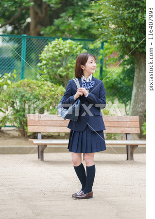 Smiling female high school student full body Smiling female high school student full body 116407993