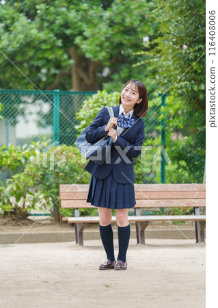 Smiling female high school student full body 116408006