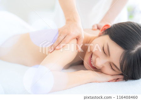 A middle-aged woman doing skin care at a beauty salon A middle-aged woman doing skin care at a beauty salon 116408460