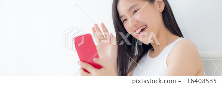 Young asian woman using smartphone for video conference online with friends. Young asian woman using smartphone for video conference online with friends. 116408535